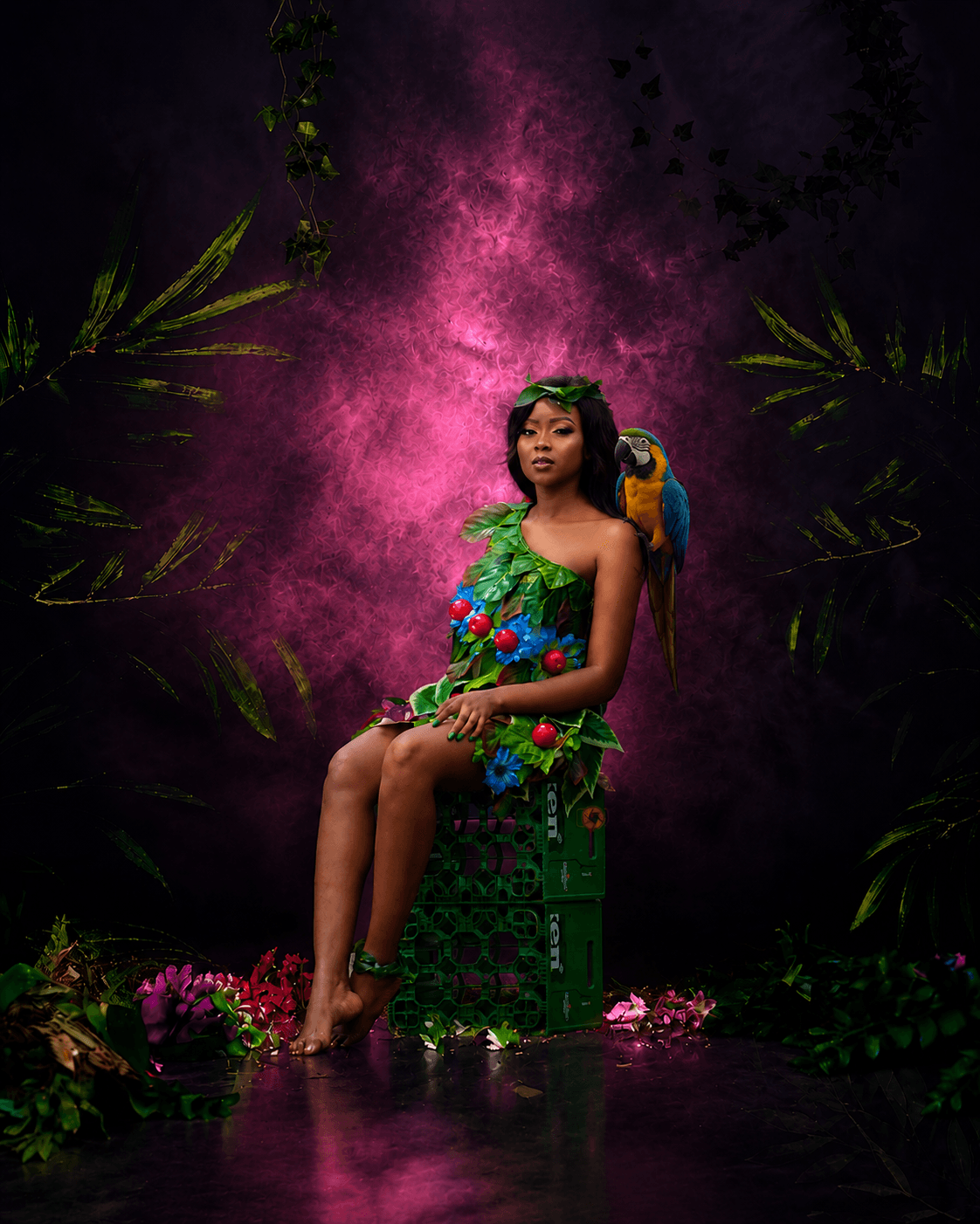 Creatively directed portrait of a seated woman with a parrot